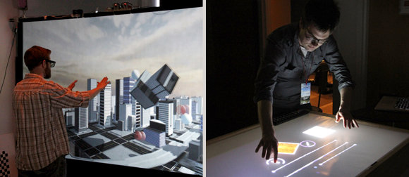 A man interacting with a 3D cityscape with his hands, A man using a table display