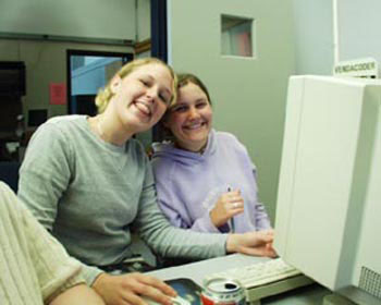 two young women at a computer
