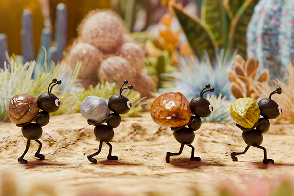 Stylized harvester ants acting as guides through a subterranean tunnel toward a fossil exhibition, featuring a hand-crafted 3D aesthetic.