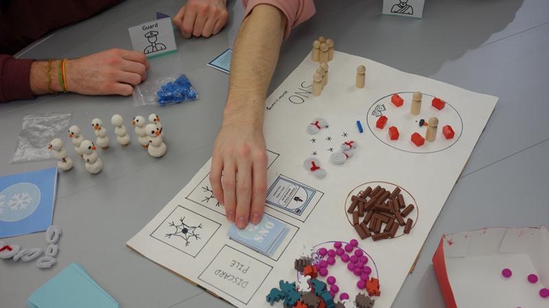 Participants playing an analog game in the board game extravaganza during Autumn 2021 finals