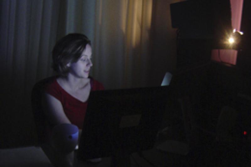 Woman working behind computer