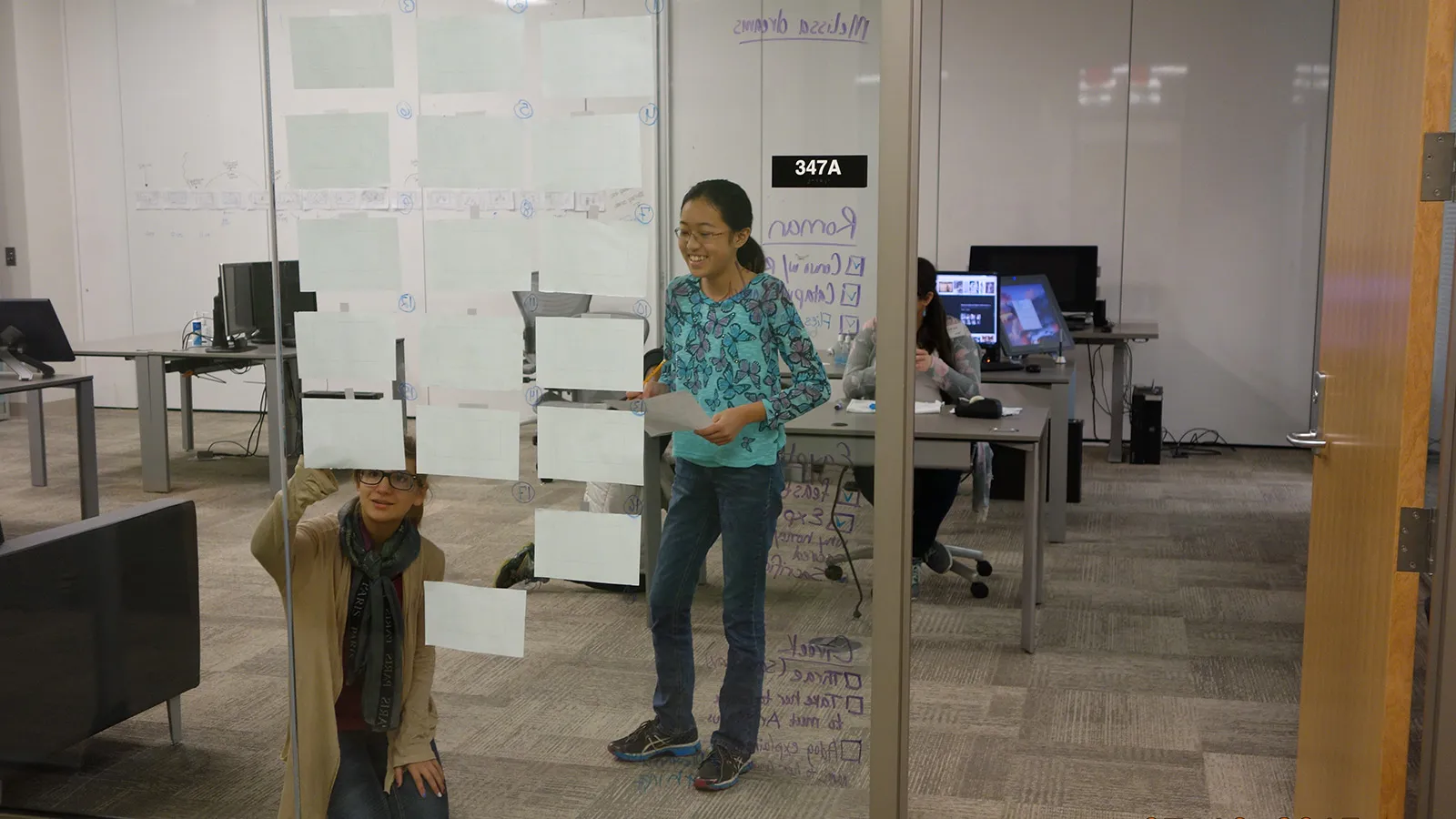 Students working on the wall