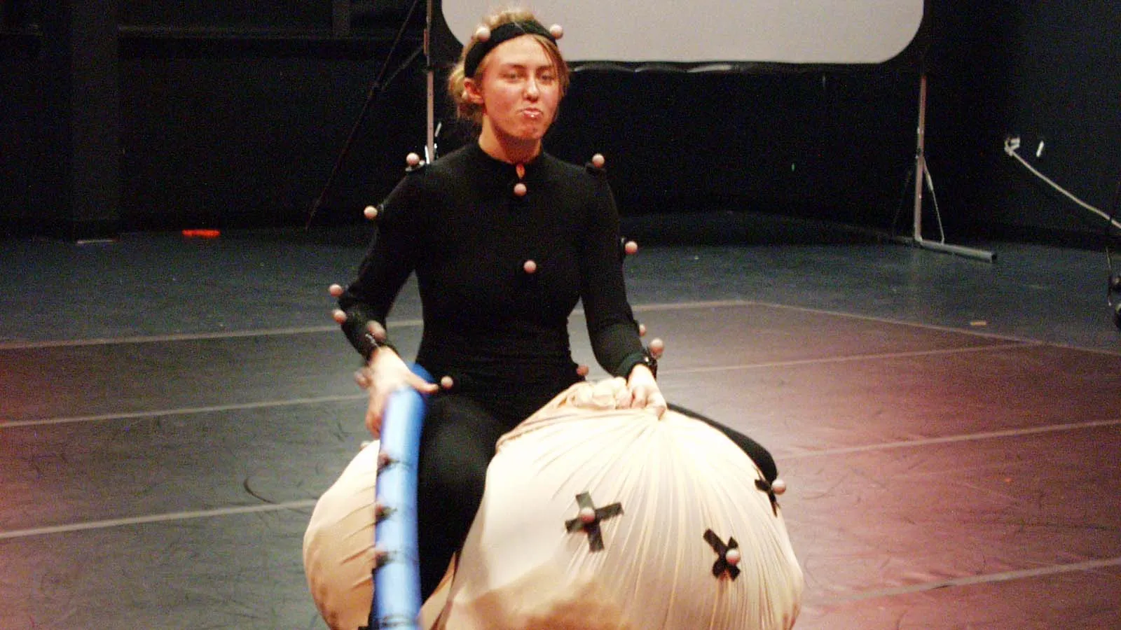 student working with a motion capture suit