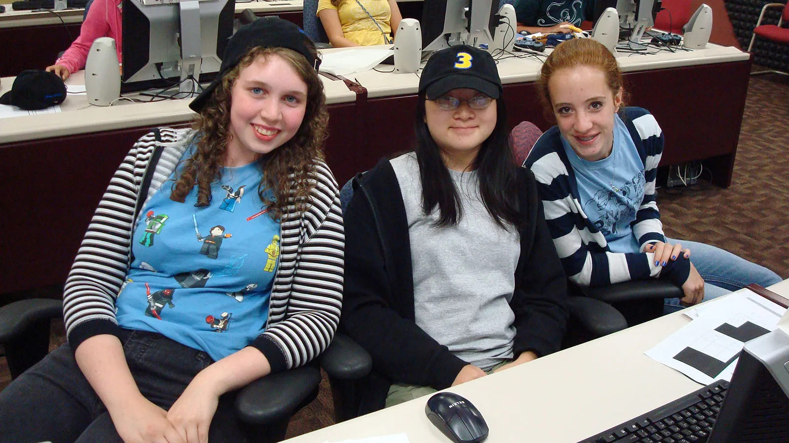 three students in computer lab