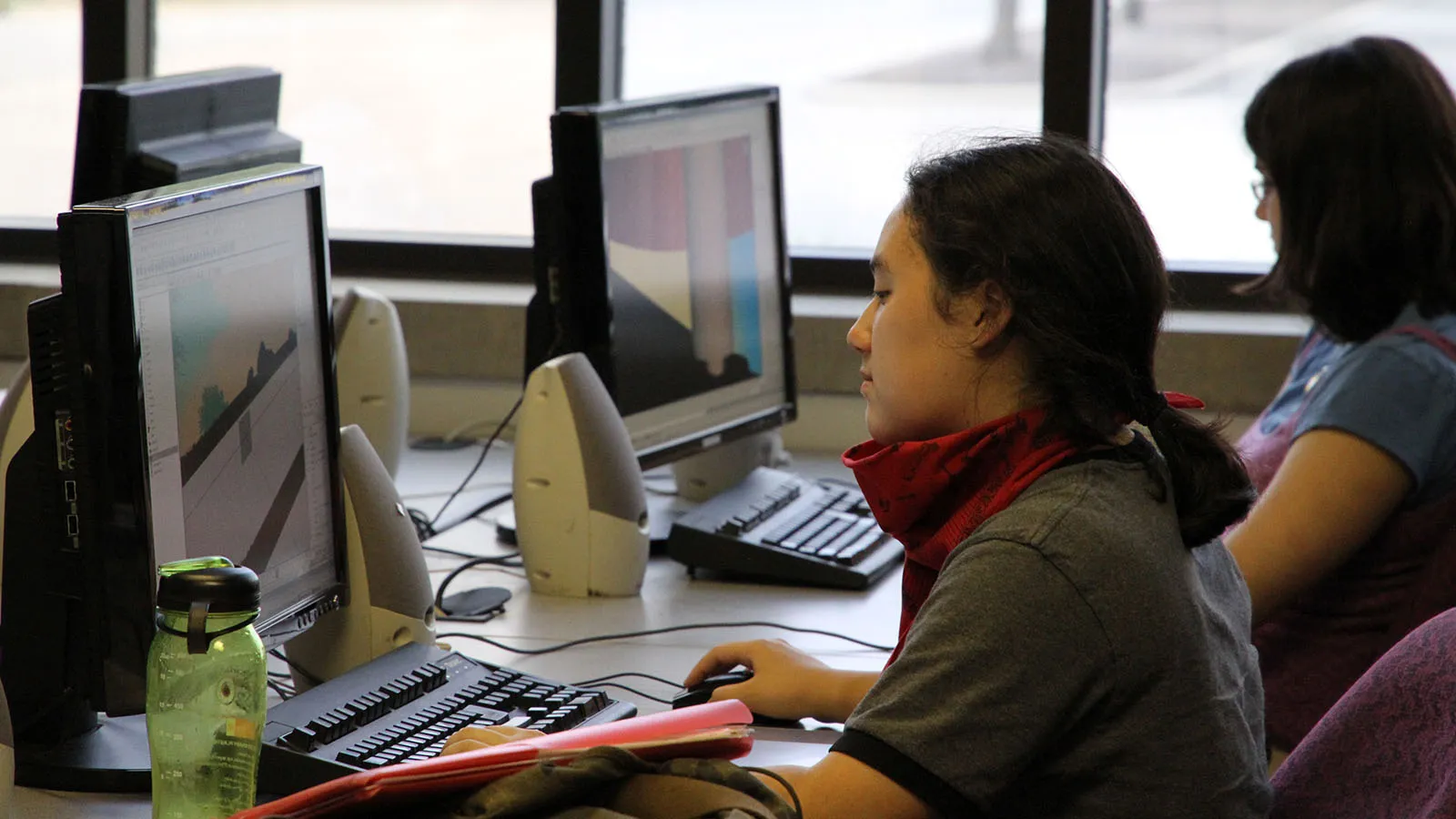 two students working at computers