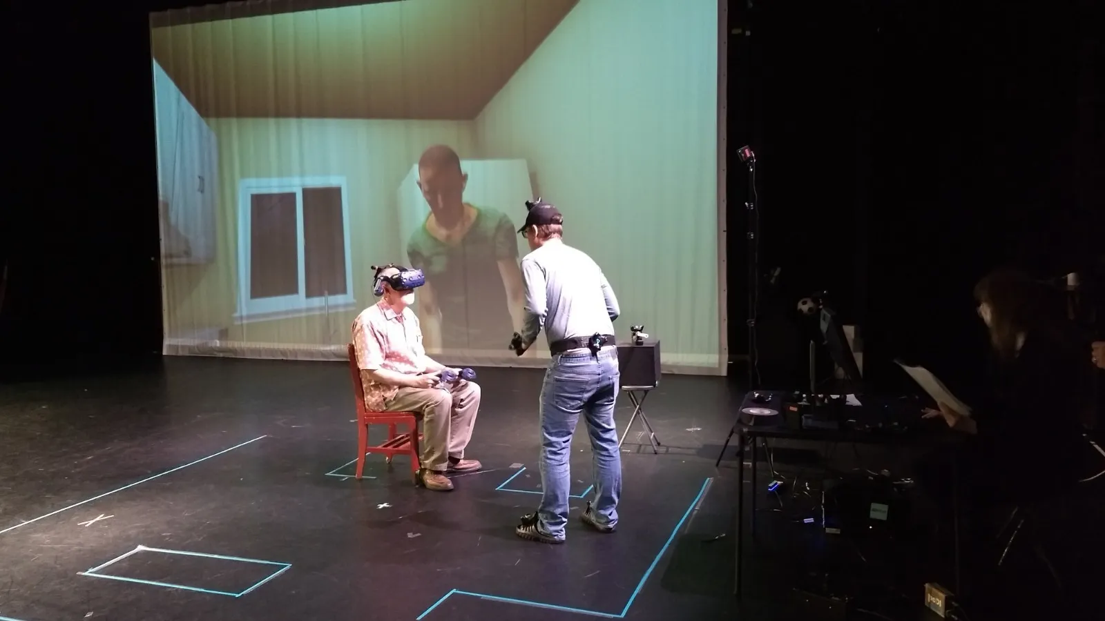 Alex Oliszewski interacts with a volunteer for the Dementia VR patient experience