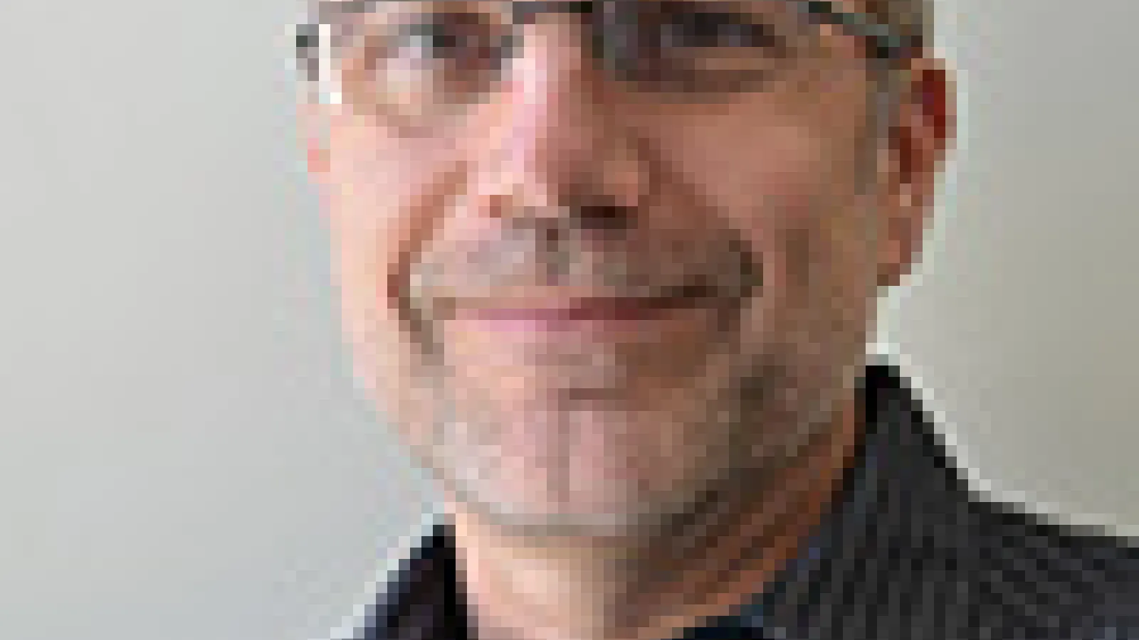 Man grinning at camera