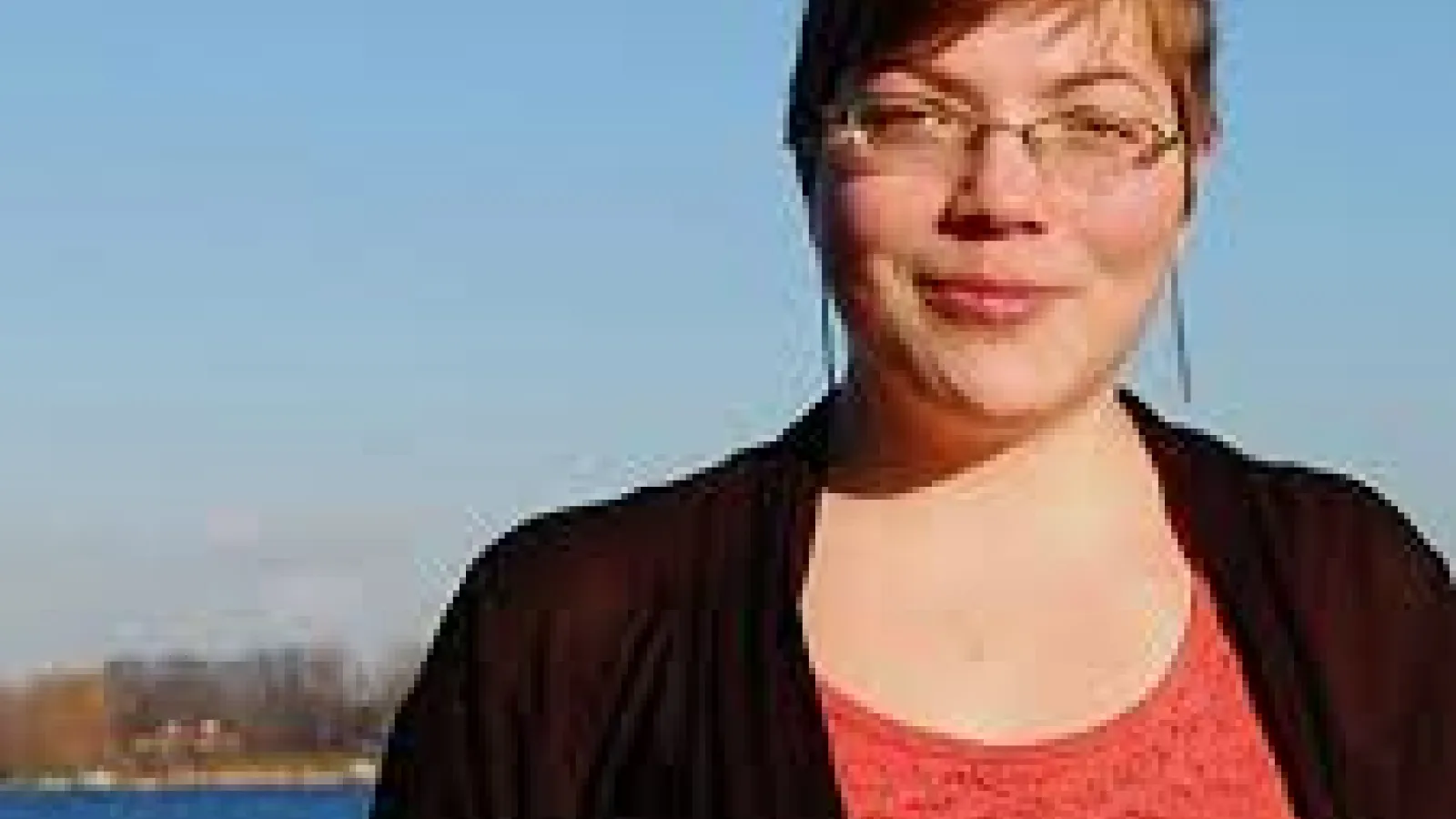 Woman outside smiling 