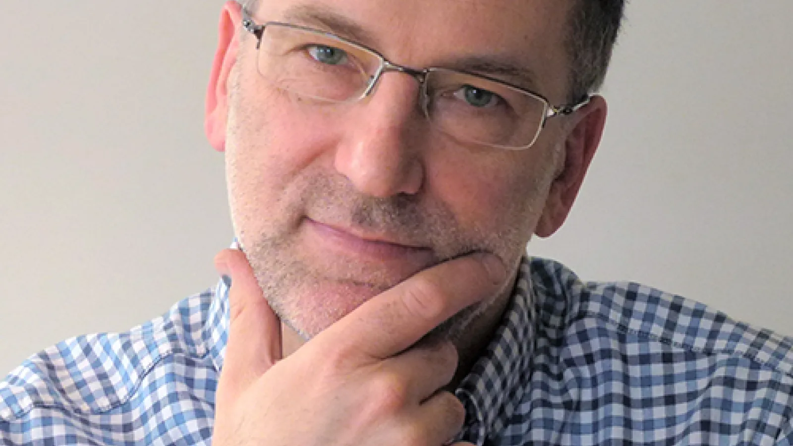 Man posing with hand on face