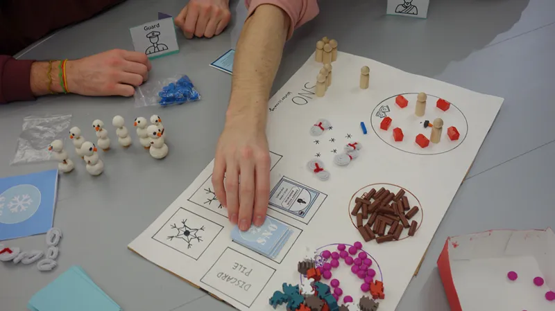 Participants playing an analog game in the board game extravaganza during Autumn 2021 finals