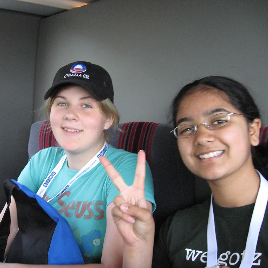 two students sitting on the bus