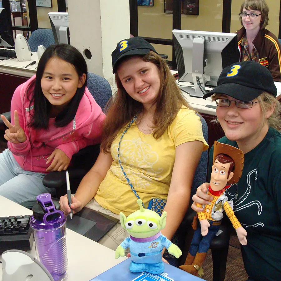 three students in the computer lab