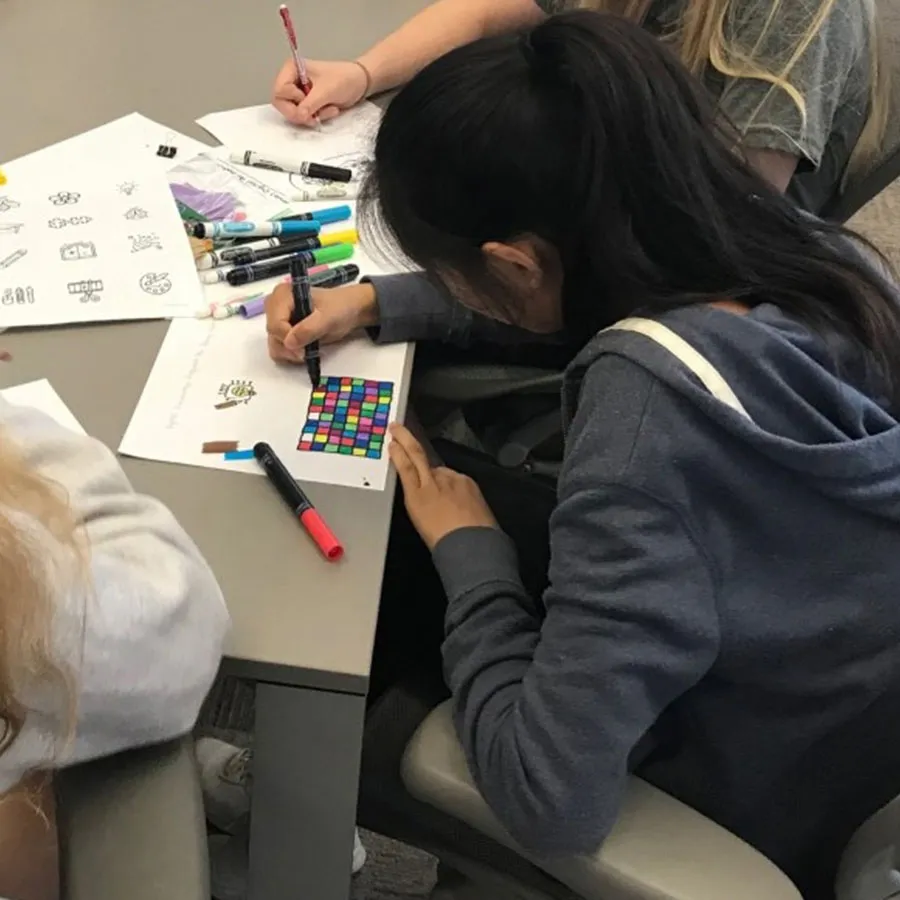 student sketching by hand