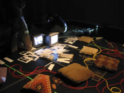 Pillows and monitors on ground