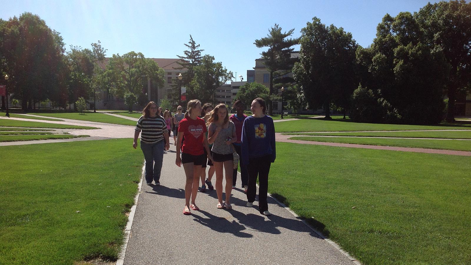 Students walking on campus grounds