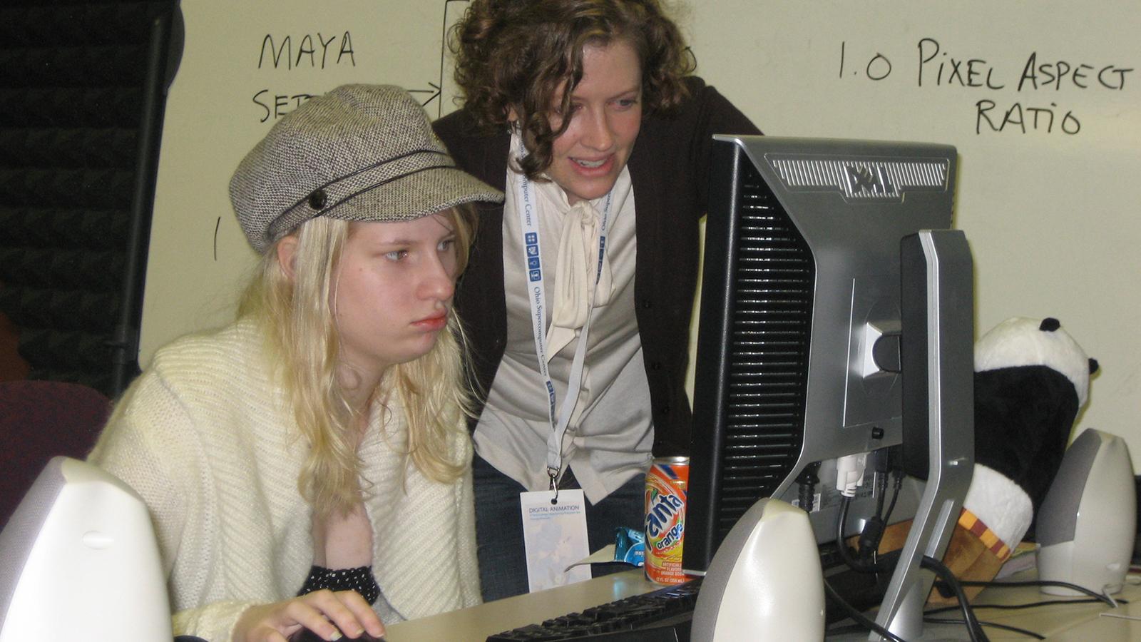 Student and mentor working at computer