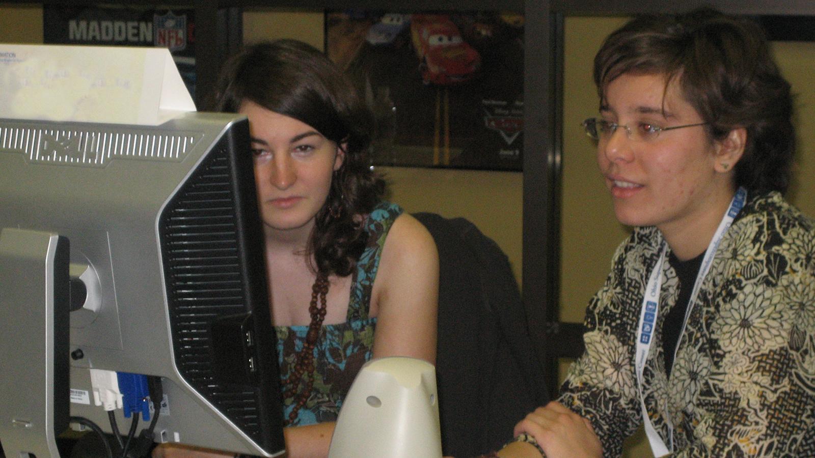 Student and mentor working at a computer
