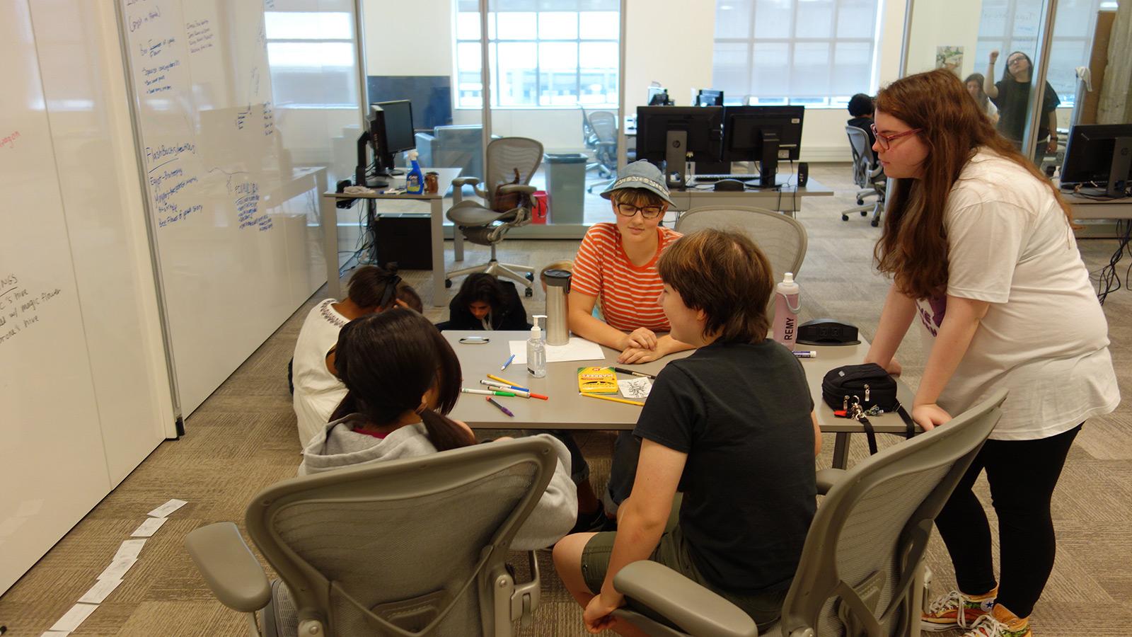 Students collaborating at table