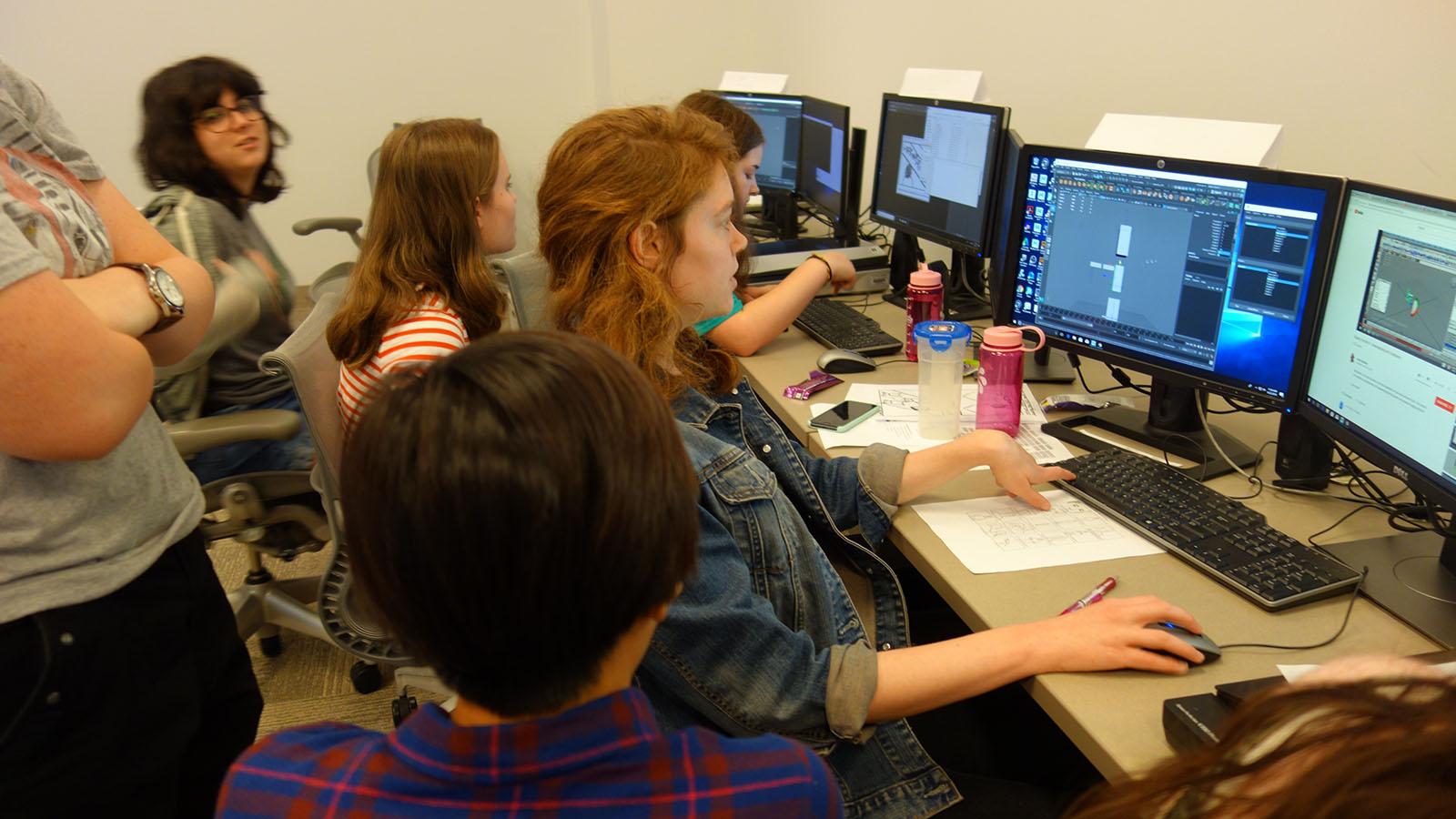 students and mentors working at computers