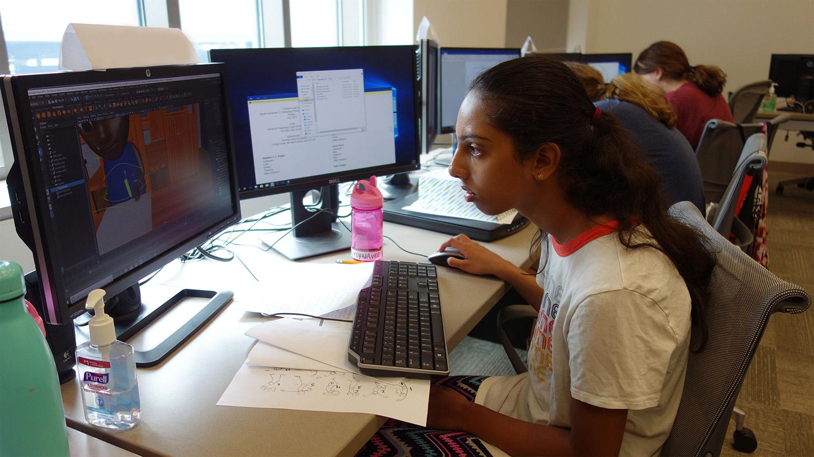 student at computer working on a digital animation