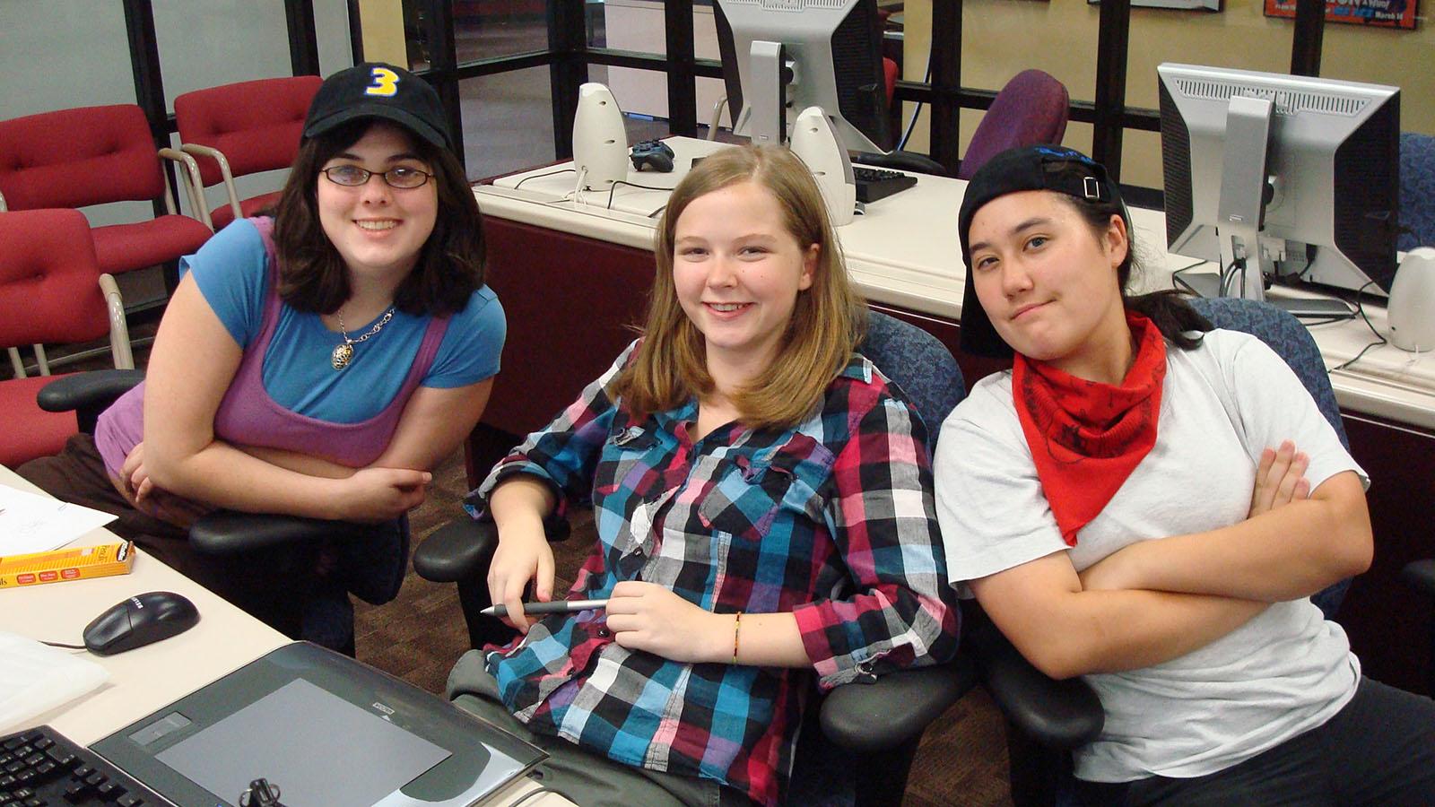 three students in computer lab
