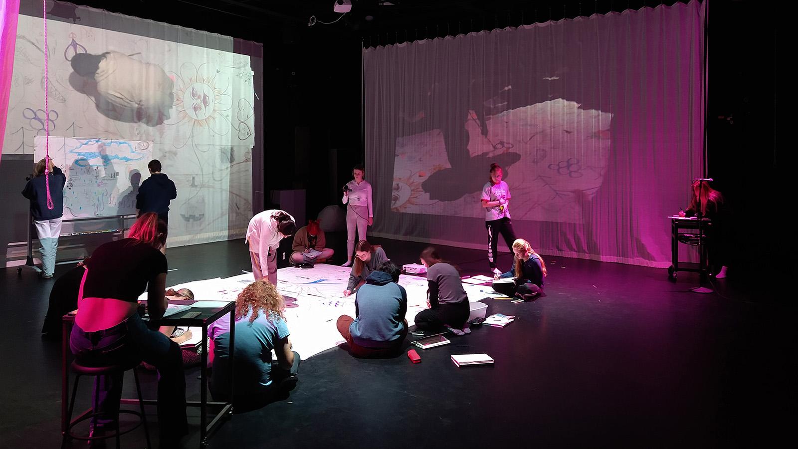 A zoomed-out shot of students creating art projects in the Motion Lab