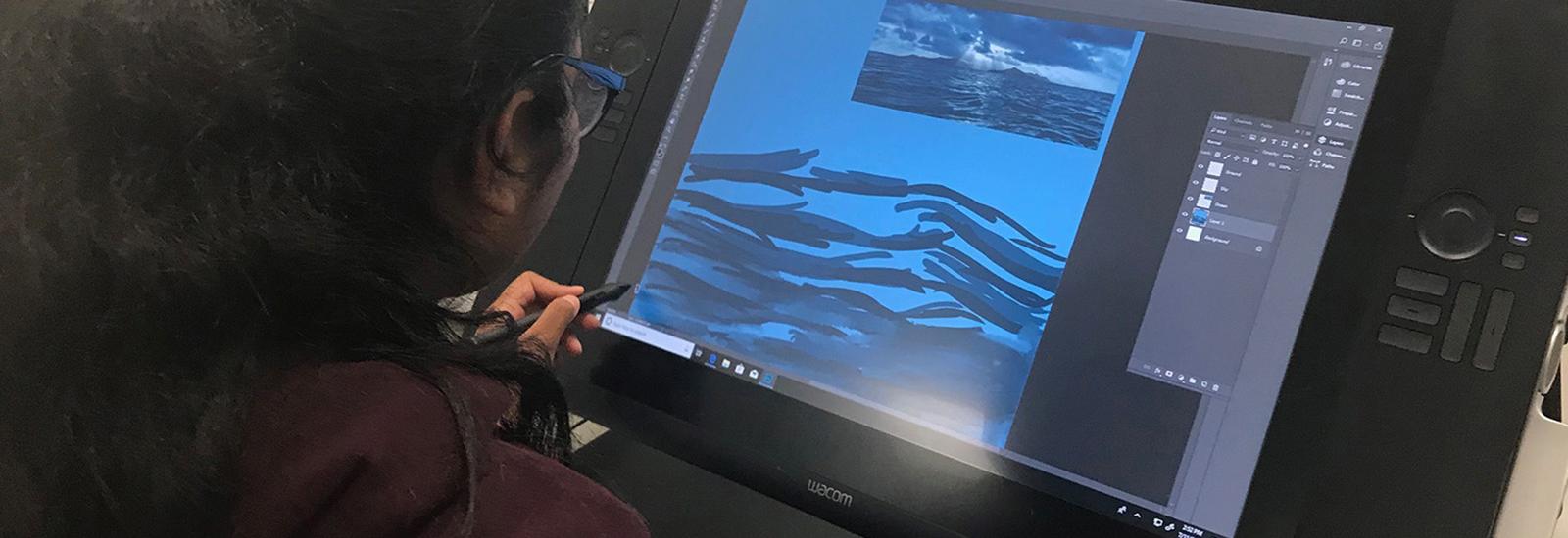 Student creating a digital animation